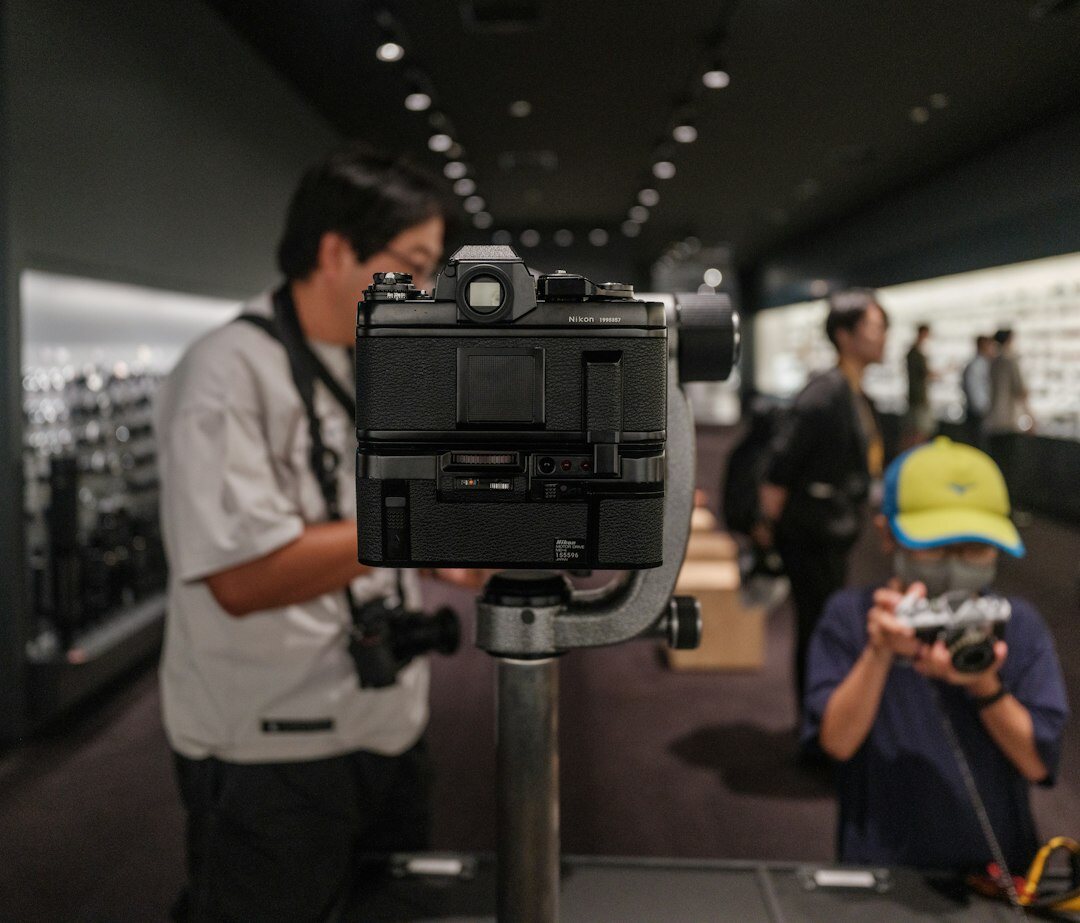 Professional camera and stage lighting setup at a press event