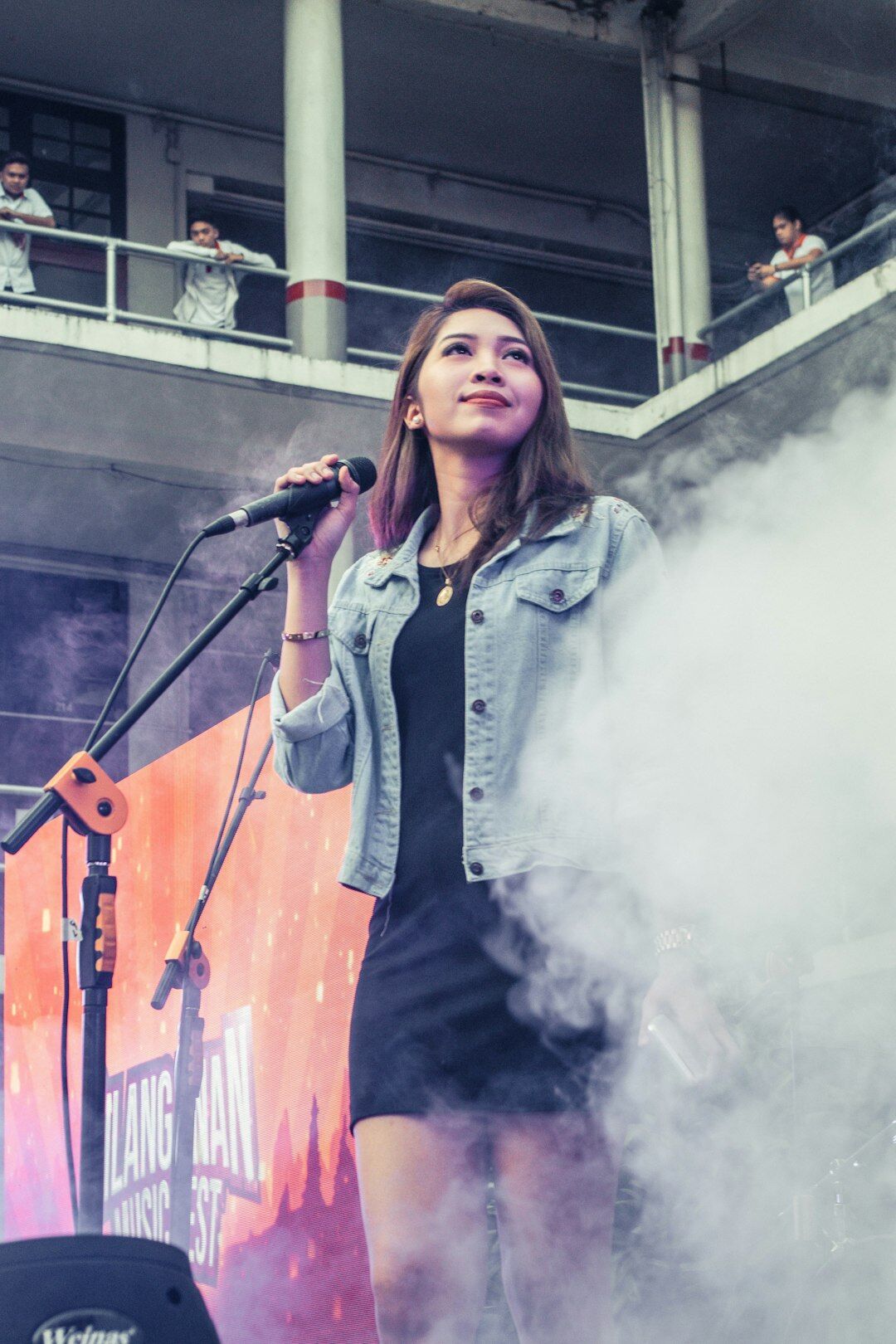 woman singing on stage